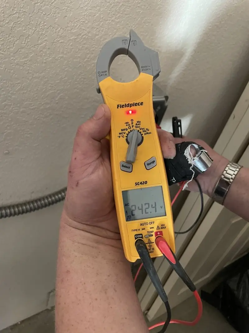 Voltage testing with clamp meter during Circuit Breaker Repair in Essex Junction